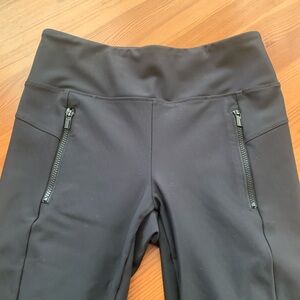 EUC - Athleta leggings, BLACK  with two front hip zippers . Size medium.
